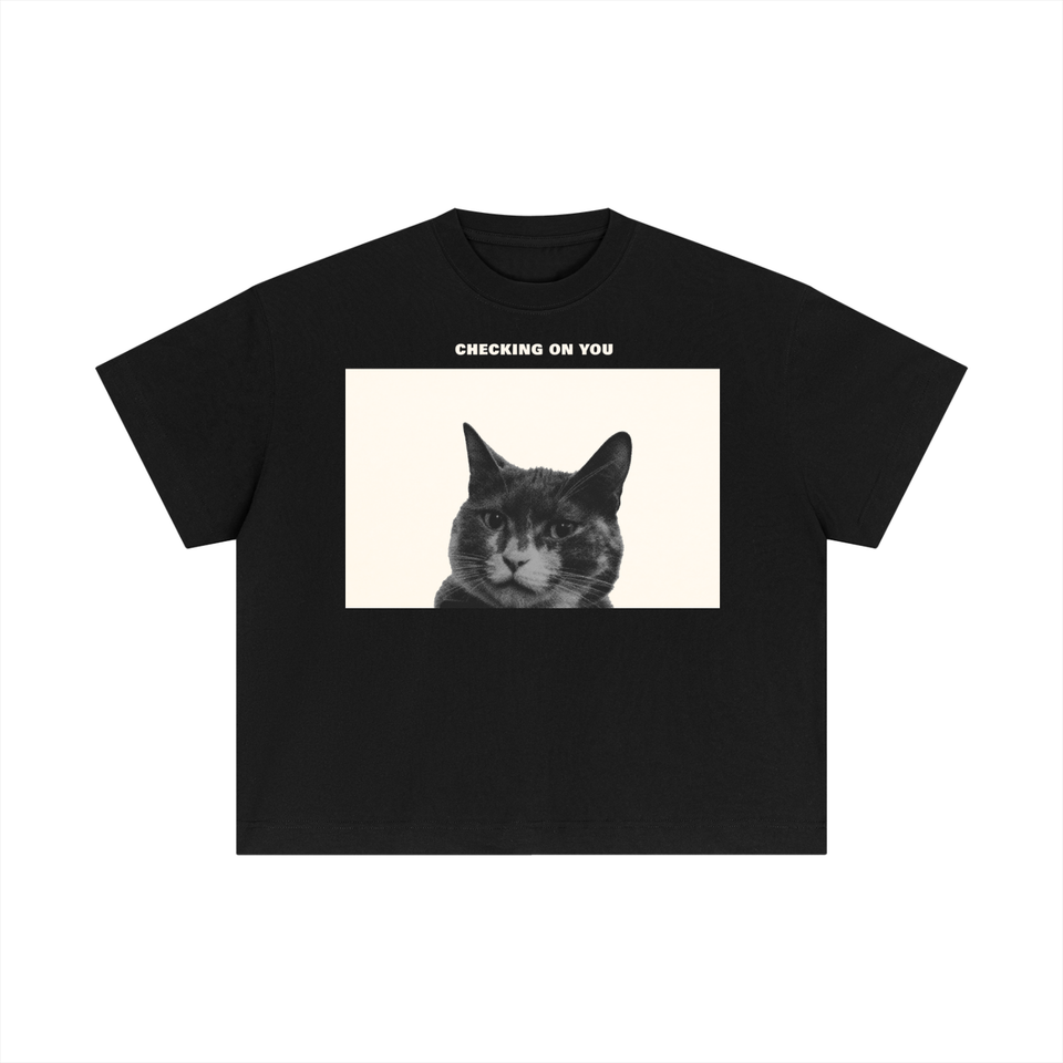 Essential Cotton Boxy T-Shirt in black, front view, printed with a photograph of a cat and the words Checking On You