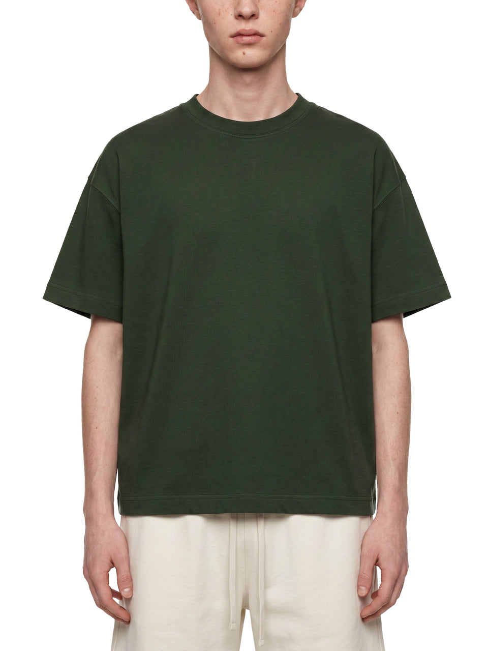 Essential Cotton Boxy T-Shirt in dark green, worn by a model, front view